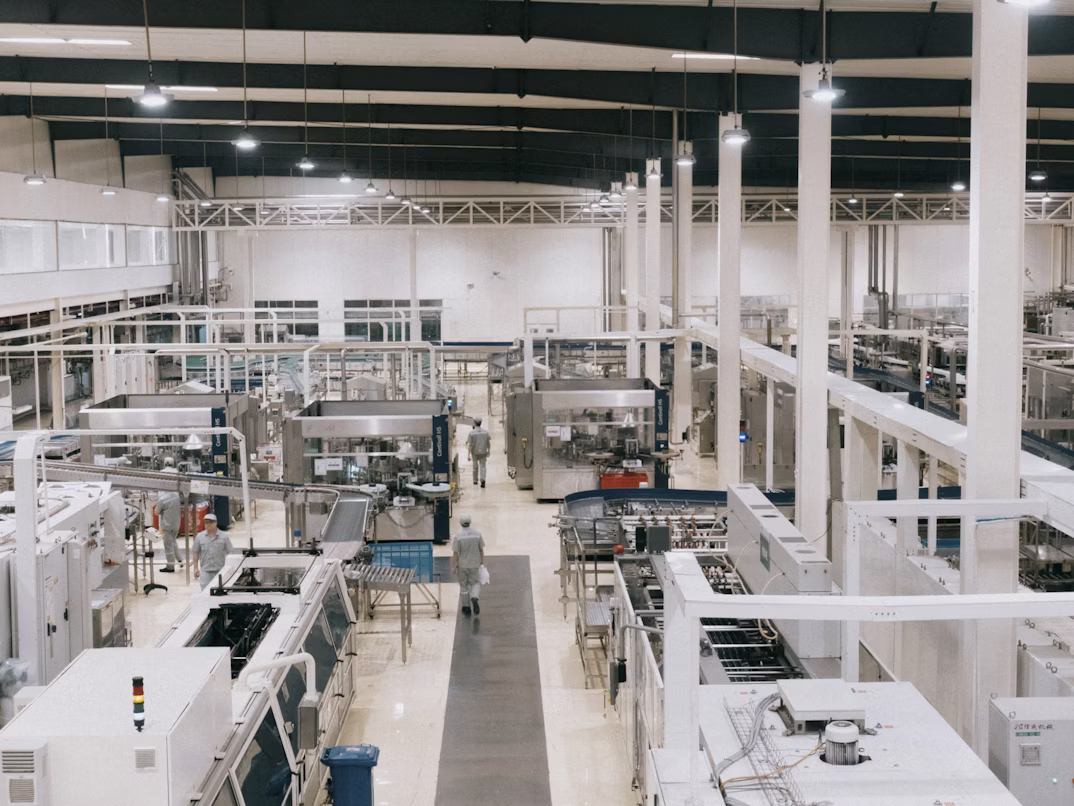 Large manufacturing facility floor — custom evacuation route maps for industrial and warehouse facilities